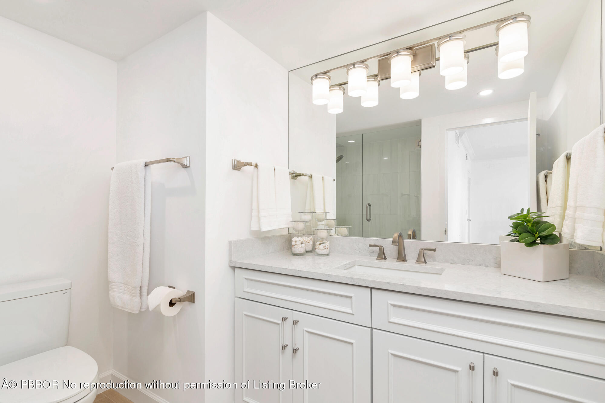 354 Chilean Avenue, Unit 6C Palm Beach, FL 33480 - Photo 12 of 21 a bathroom with a sink a toilet and shower