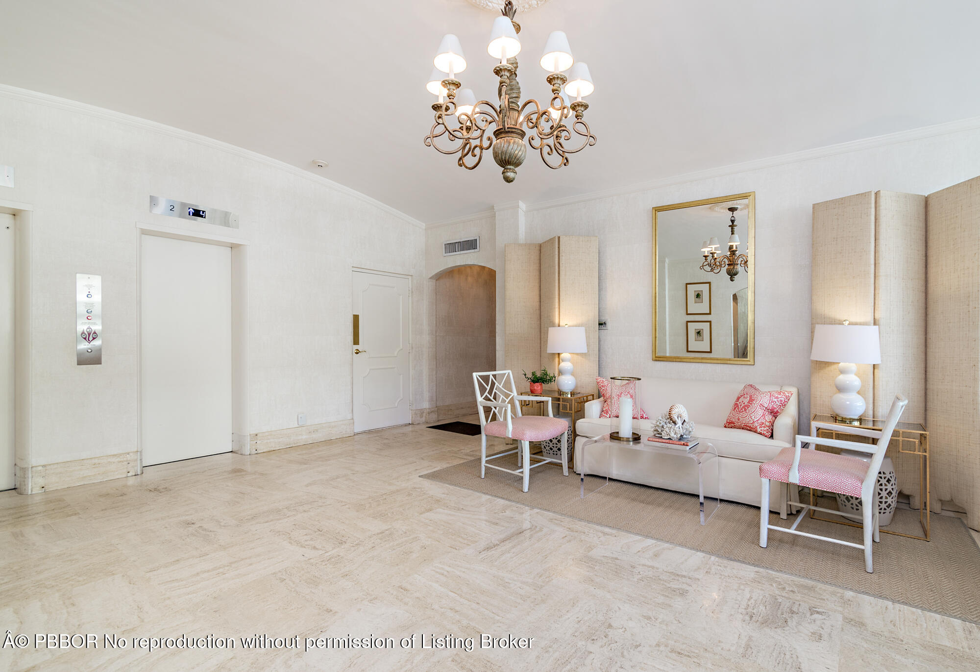 354 Chilean Avenue, Unit 6C Palm Beach, FL 33480 - Photo 16 of 21 a living room with furniture and a chandelier