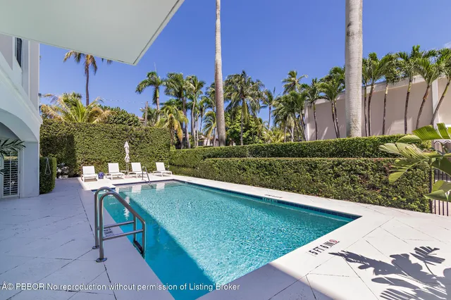a view of a chairs and table in patio