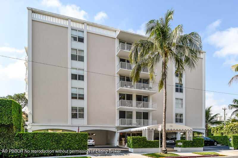 354 Chilean Avenue, Unit 6C Palm Beach, FL 33480 - Photo 21 of 21 a front view of a building with a garden