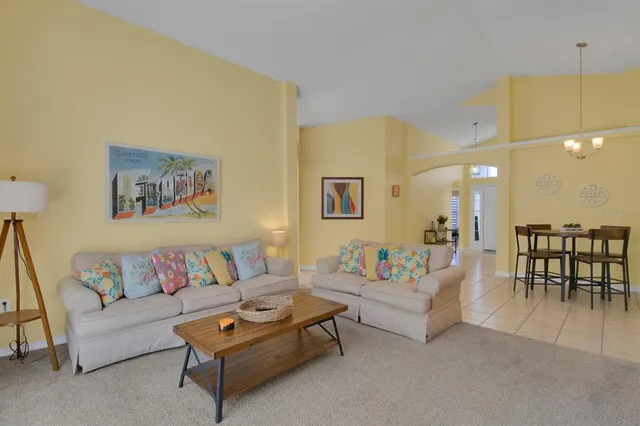 a living room with furniture and a table