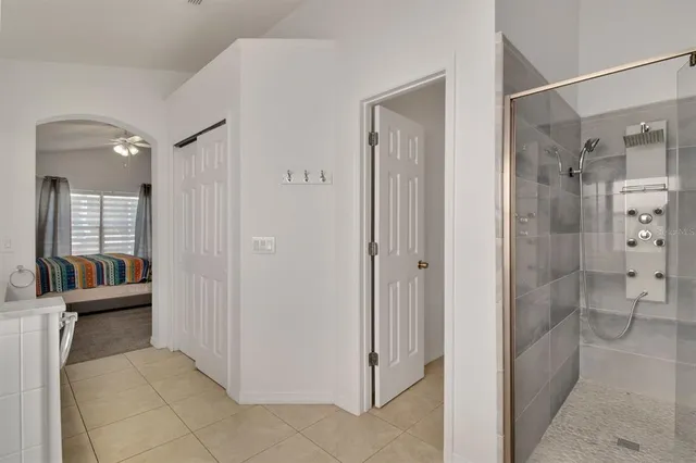 a bathroom with a shower and a sink