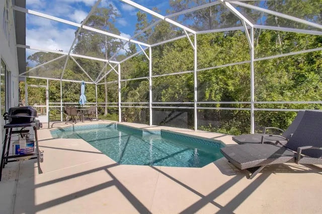a view of a chairs and table on the deck