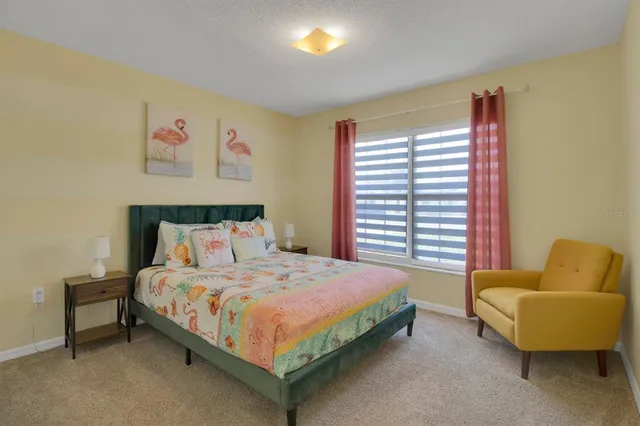 a bedroom with a bed and a couch