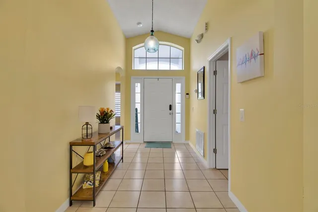 a view of a hallway and wooden floor
