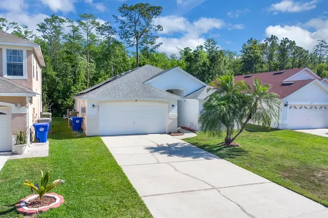 a aerial view of a house with a yard
