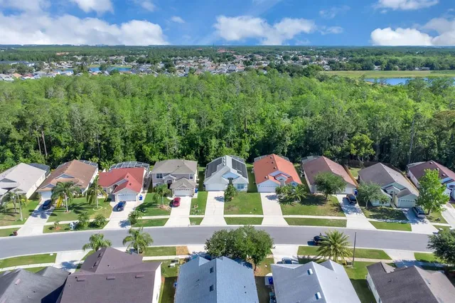an aerial view of a house with a garden