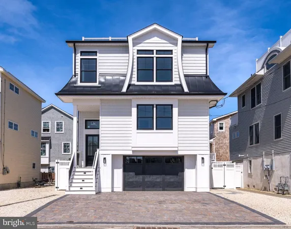 a front view of a house with a garage