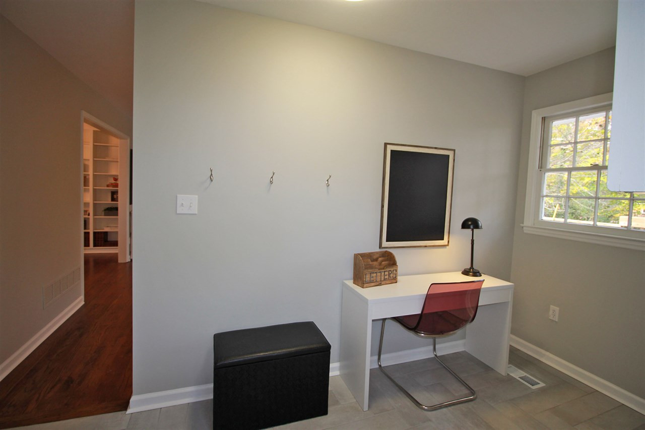 308 Lord Berkley Road Raleigh, NC 27610 - Photo 10 of 25 This mudroom/laundry room is fantastic! There is room for hooks to hang up sweaters, purses, hats and back packs and also room for a bill paying desk! Notice the herringbone patterned ceramic tile floor. Gorgeous! Mudroom / Laundry Room