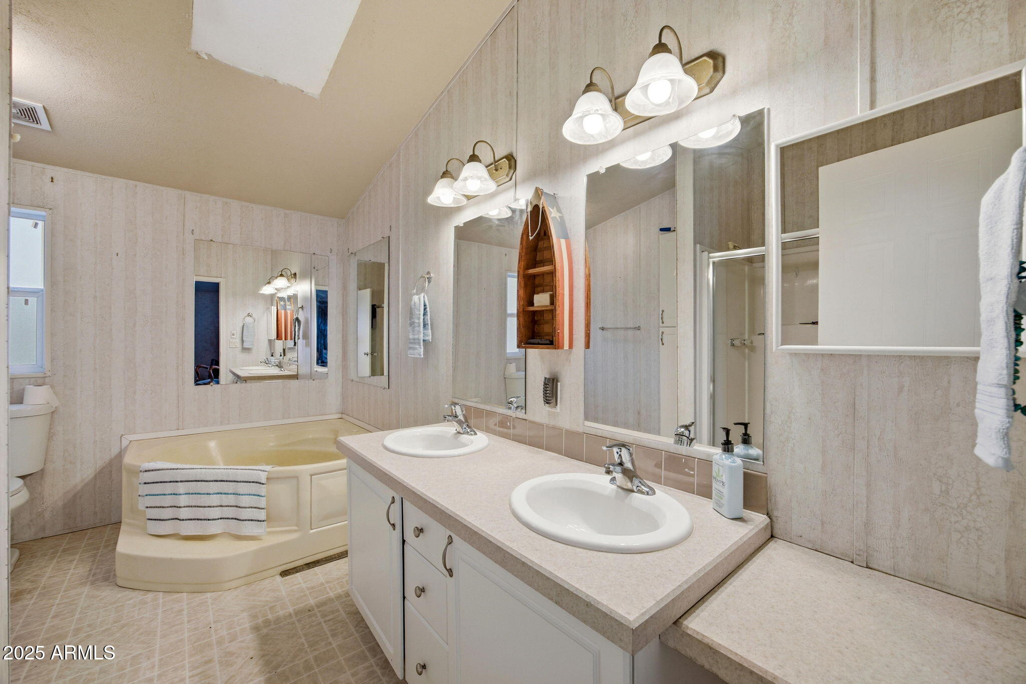 2190 Wildlife Trail Overgaard, AZ 85933 - Photo 16 of 34 a bathroom with a sink and a mirror