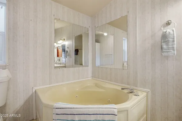 a view of a bedroom from a hallway
