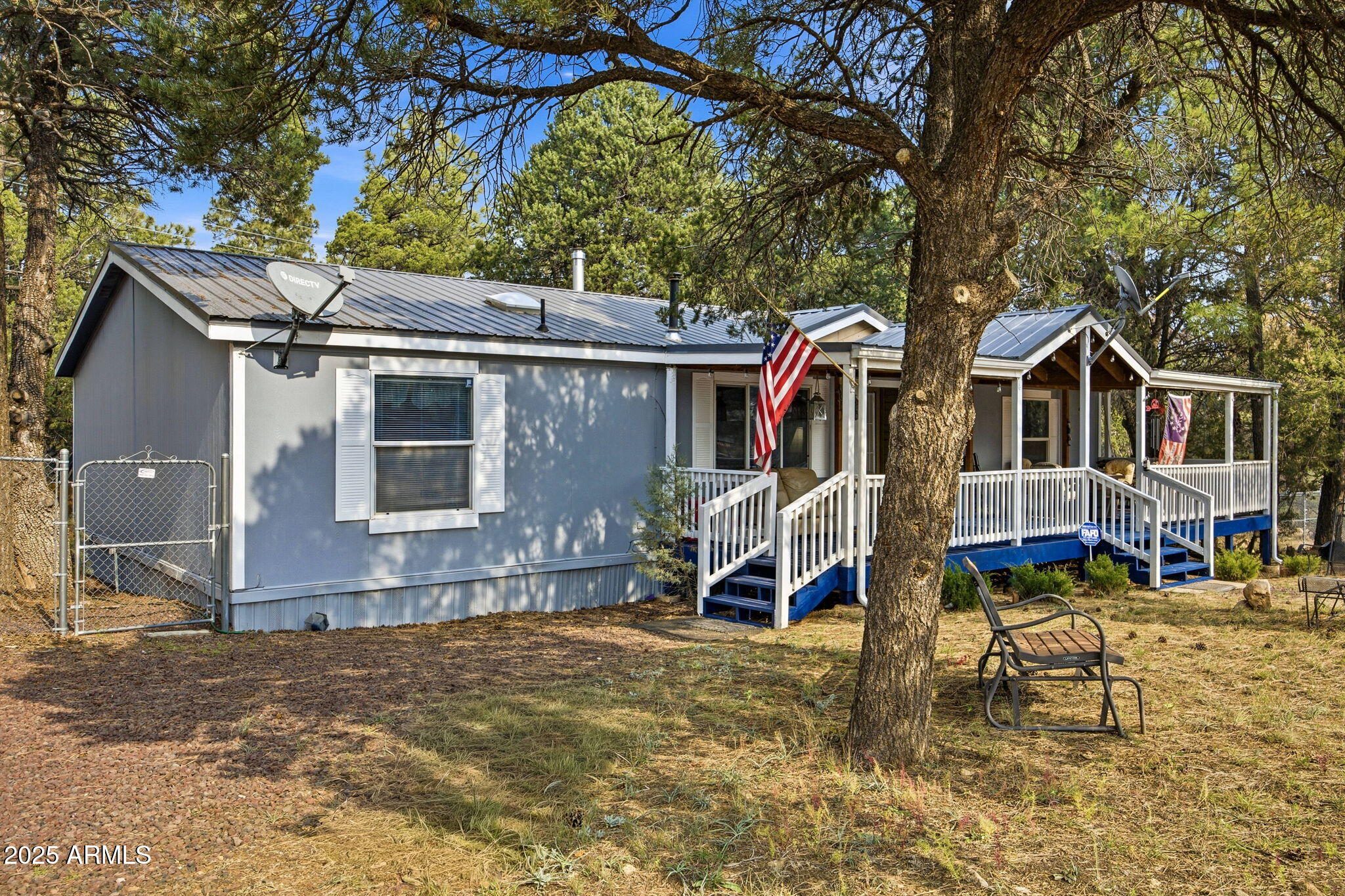 2190 Wildlife Trail Overgaard, AZ 85933 - Photo 2 of 34 a view of a house with a yard and wooden fence