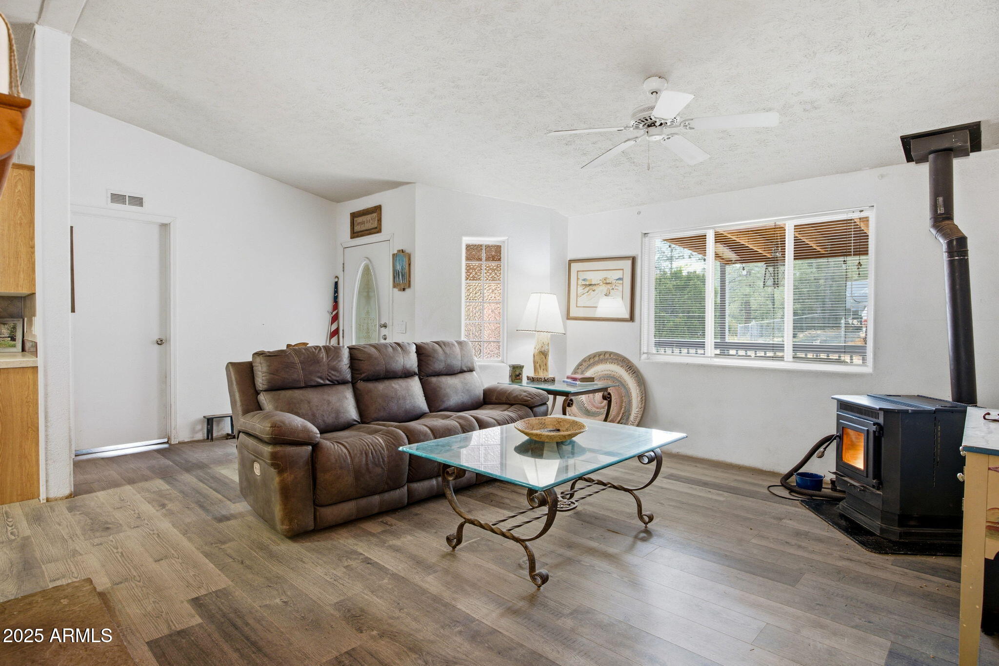 2190 Wildlife Trail Overgaard, AZ 85933 - Photo 8 of 34 a living room with furniture and a window