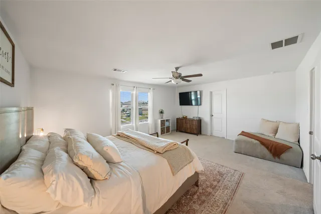 a large white bed in a white room