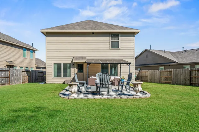 a view of a house with a yard porch and furniture