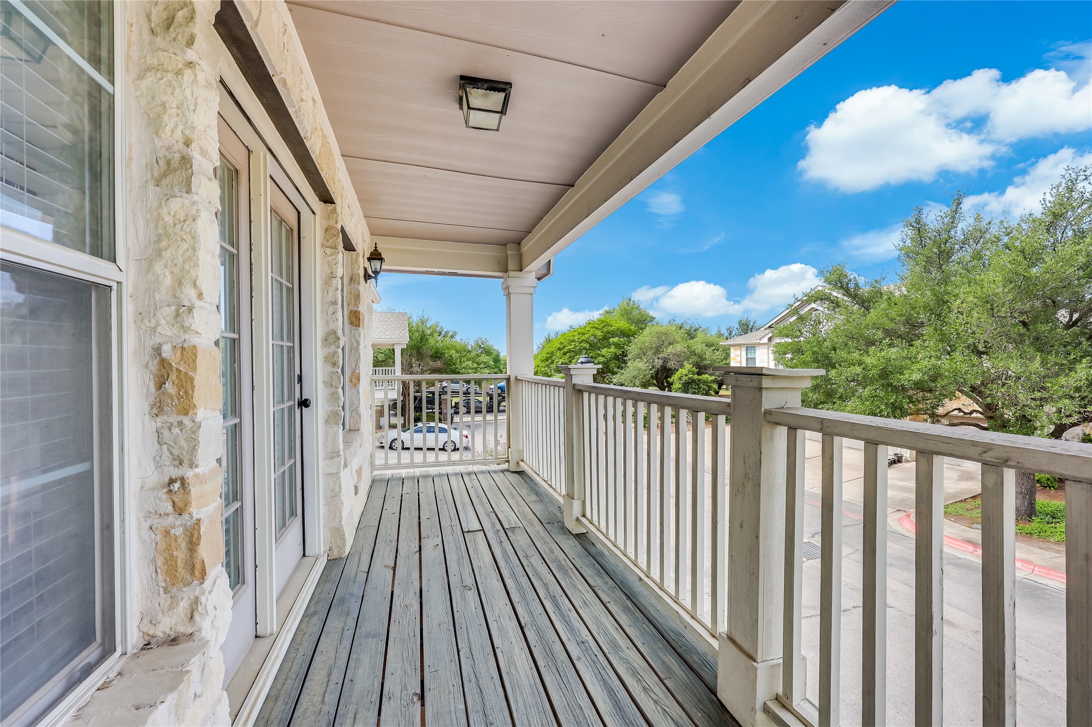 1900 Scofield Ridge Parkway, Unit 501 Austin, TX 78727 - Photo 26 of 31 a view of a balcony with wooden floor