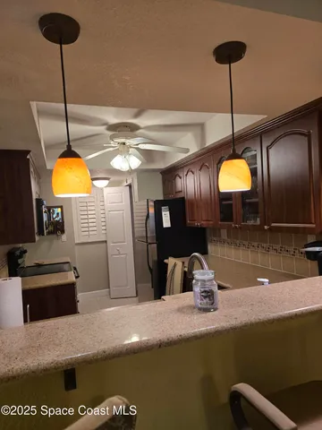 a kitchen with a counter space a sink and appliances