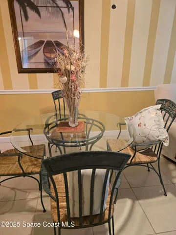 a view of a dining room with furniture and window