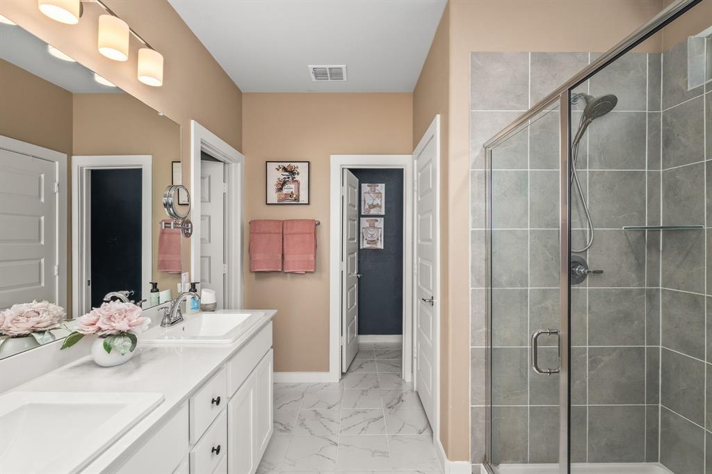 4017 Mapleleaf Pass Melissa, TX 75454 - Photo 14 of 32 a bathroom with a double vanity sink mirror and shower