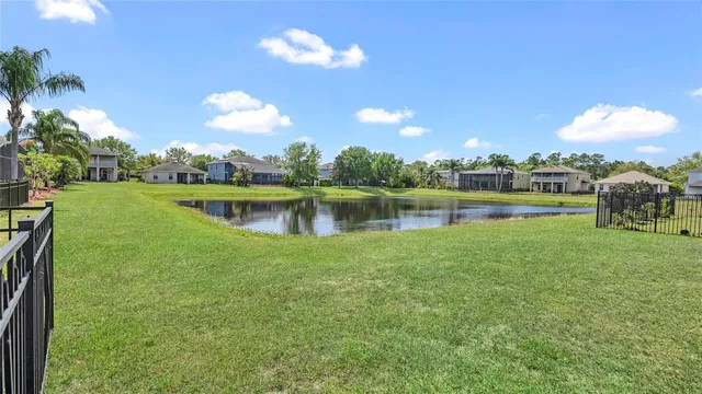 a view of a lake with a big yard