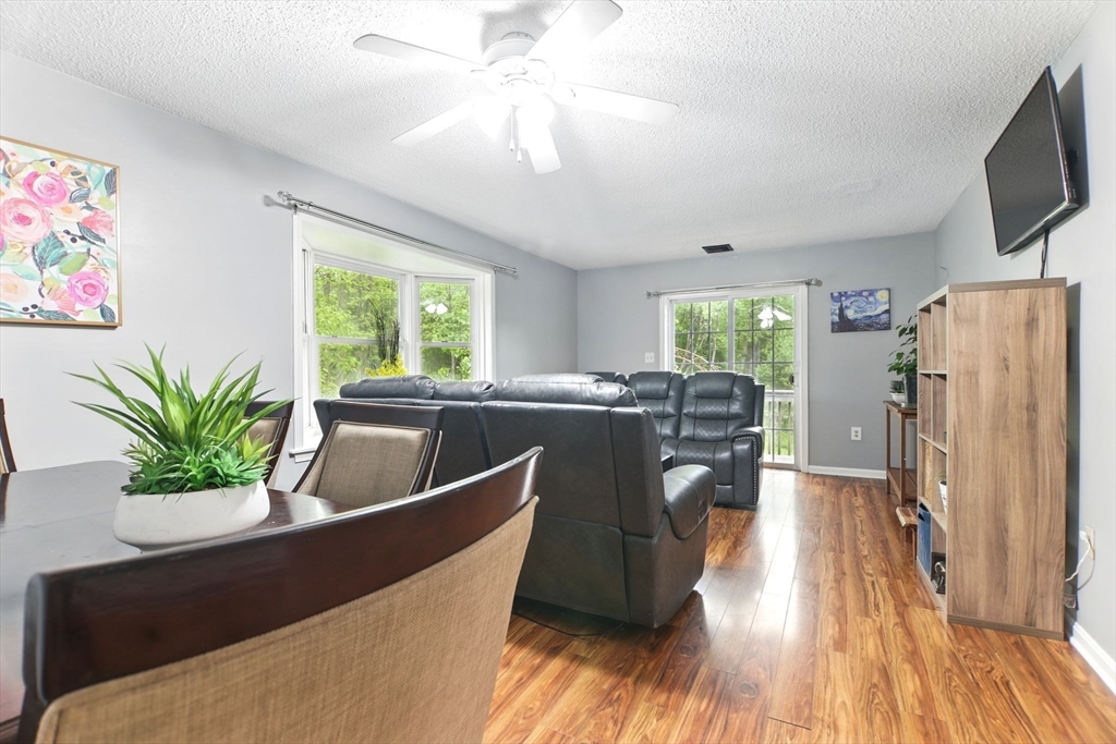 59 Castlegate Drive, Unit B Springfield, MA 01129 - Photo 14 of 42 a living room with furniture and a flat screen tv