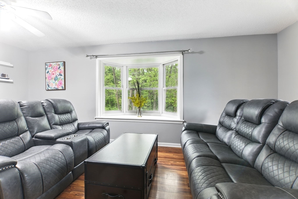 59 Castlegate Drive, Unit B Springfield, MA 01129 - Photo 15 of 42 a living room with furniture and a large window