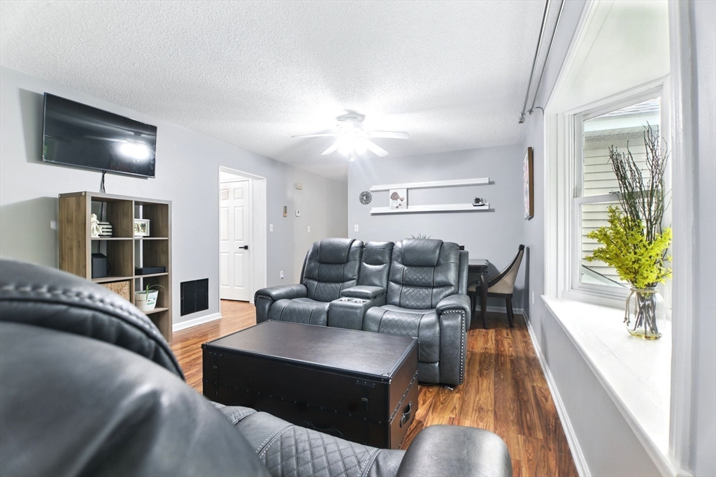 59 Castlegate Drive, Unit B Springfield, MA 01129 - Photo 16 of 42 a living room with furniture and a flat screen tv