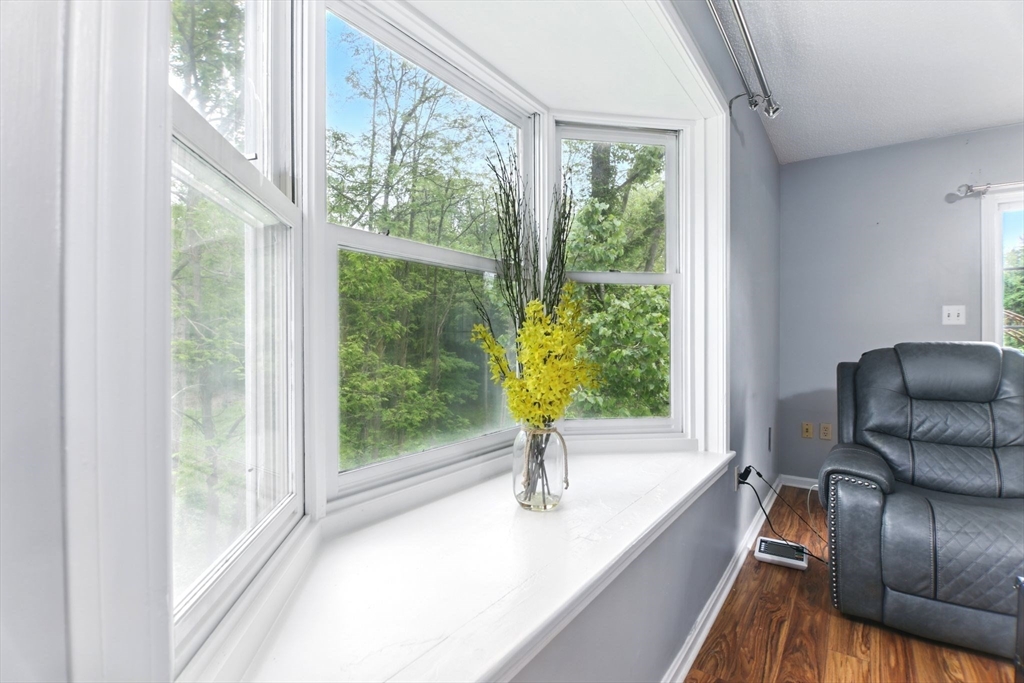 59 Castlegate Drive, Unit B Springfield, MA 01129 - Photo 17 of 42 a living room with furniture and a large window