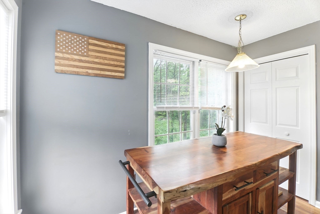 59 Castlegate Drive, Unit B Springfield, MA 01129 - Photo 20 of 42 a view of a dining room with a table and chairs