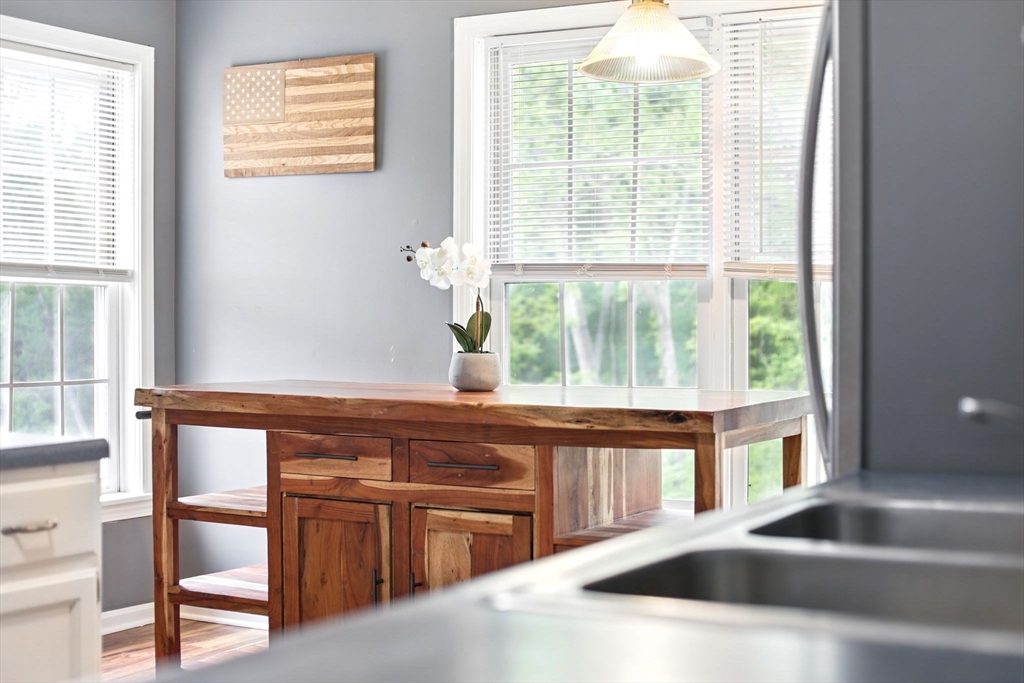 59 Castlegate Drive, Unit B Springfield, MA 01129 - Photo 22 of 42 a kitchen with a sink and large window