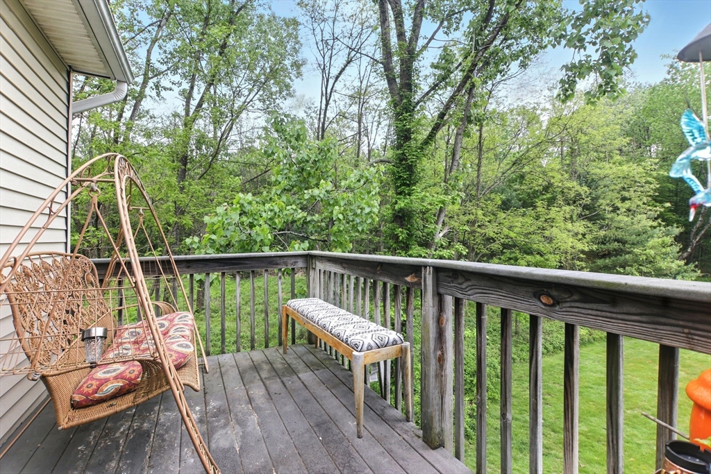 59 Castlegate Drive, Unit B Springfield, MA 01129 - Photo 29 of 42 a view of a balcony with wooden floor and outdoor seating