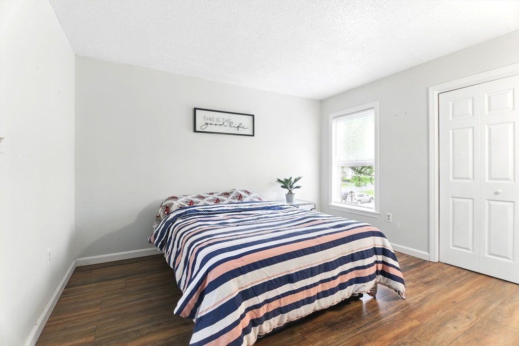 59 Castlegate Drive, Unit B Springfield, MA 01129 - Photo 30 of 42 a bedroom with a bed and a window