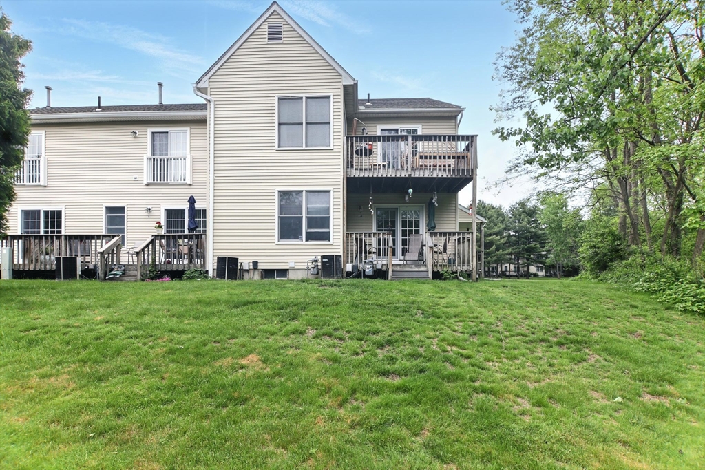 59 Castlegate Drive, Unit B Springfield, MA 01129 - Photo 37 of 42 a front view of a house with a garden