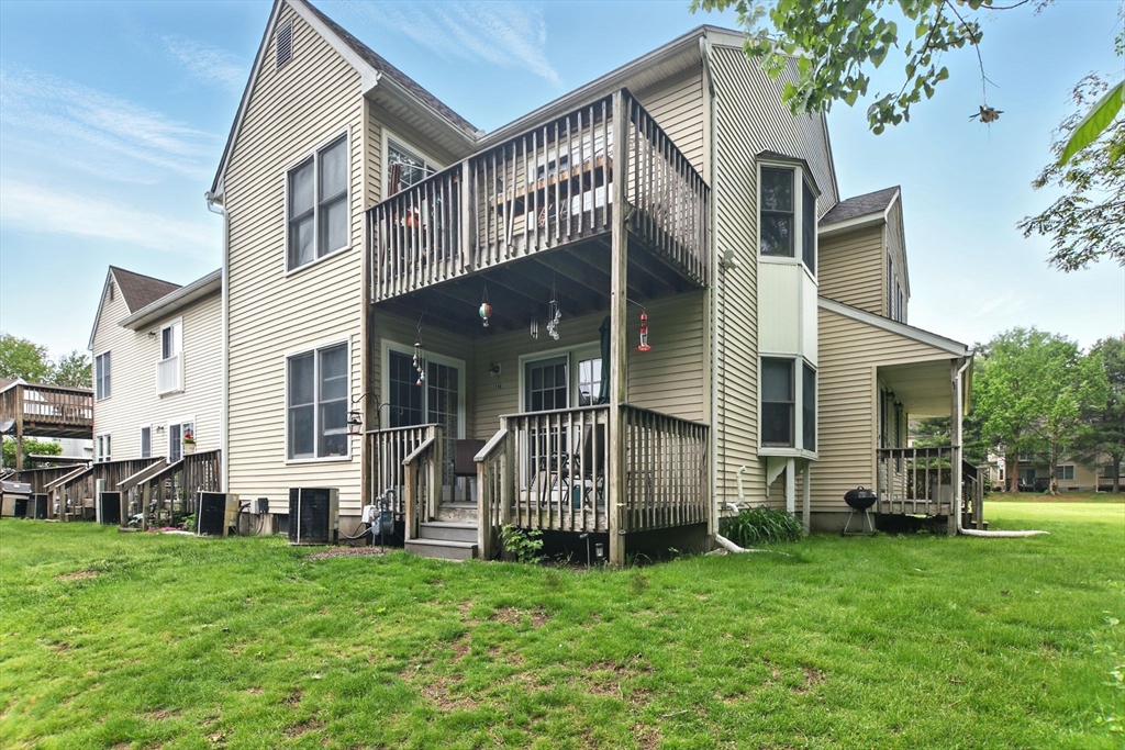 59 Castlegate Drive, Unit B Springfield, MA 01129 - Photo 39 of 42 a front view of a house with a garden