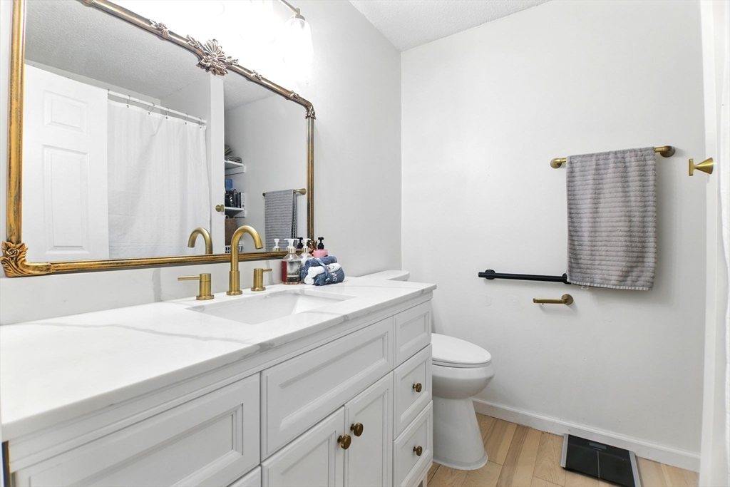 59 Castlegate Drive, Unit B Springfield, MA 01129 - Photo 5 of 42 a bathroom with a sink and a mirror