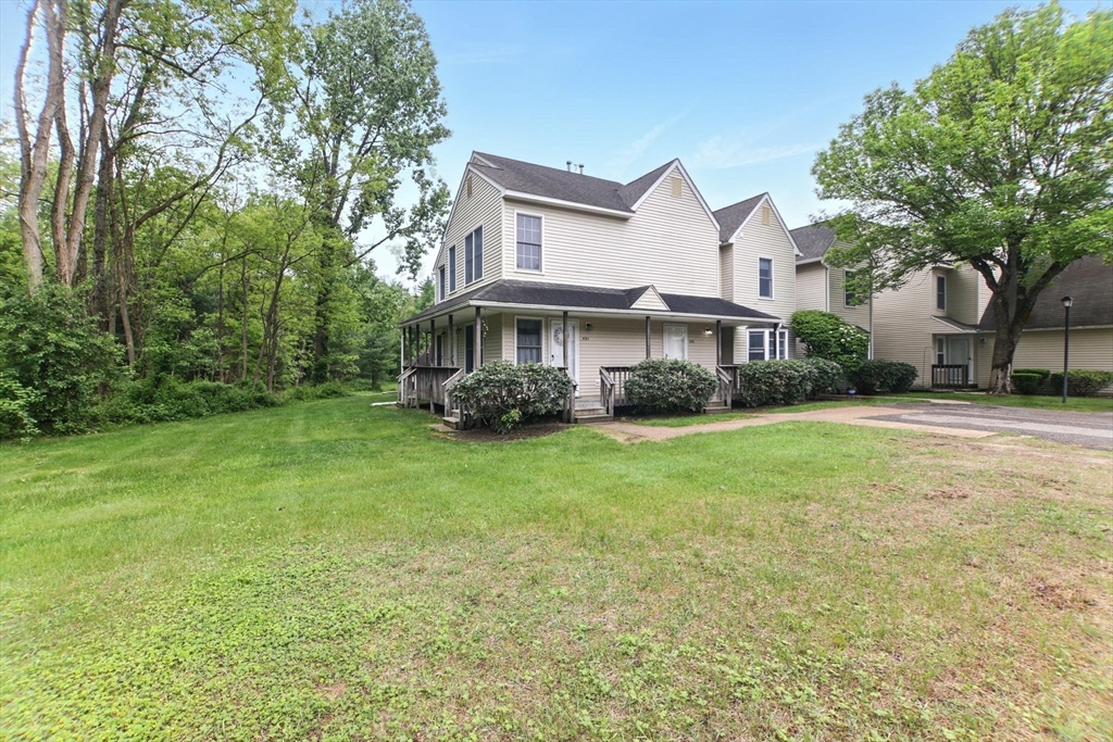 59 Castlegate Drive, Unit B Springfield, MA 01129 - Photo 9 of 42 a view of a house with a back yard