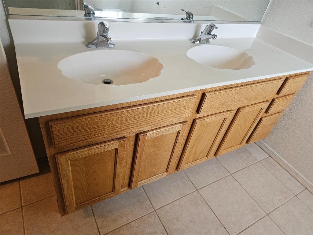 1069 Teddy Roosevelt Road Golden Valley, AZ 86413 - Photo 11 of 24 Full bath featuring double vanity and light tile patterned flooring