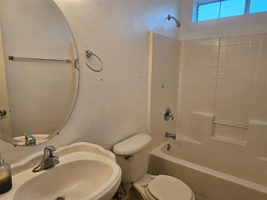 1069 Teddy Roosevelt Road Golden Valley, AZ 86413 - Photo 13 of 24 Bathroom featuring shower / tub combination and a textured wall