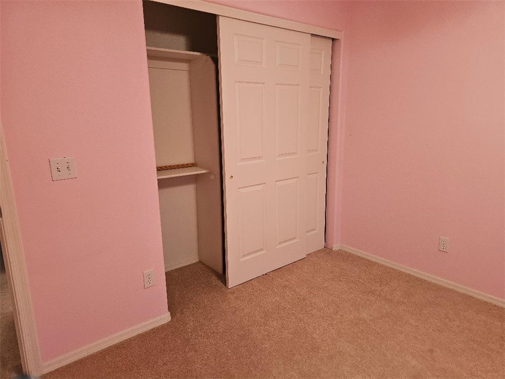 1069 Teddy Roosevelt Road Golden Valley, AZ 86413 - Photo 15 of 24 Unfurnished bedroom with light carpet and a closet