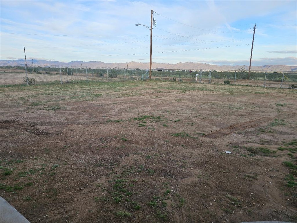1069 Teddy Roosevelt Road Golden Valley, AZ 86413 - Photo 19 of 24 View of yard featuring a rural view and a mountain view