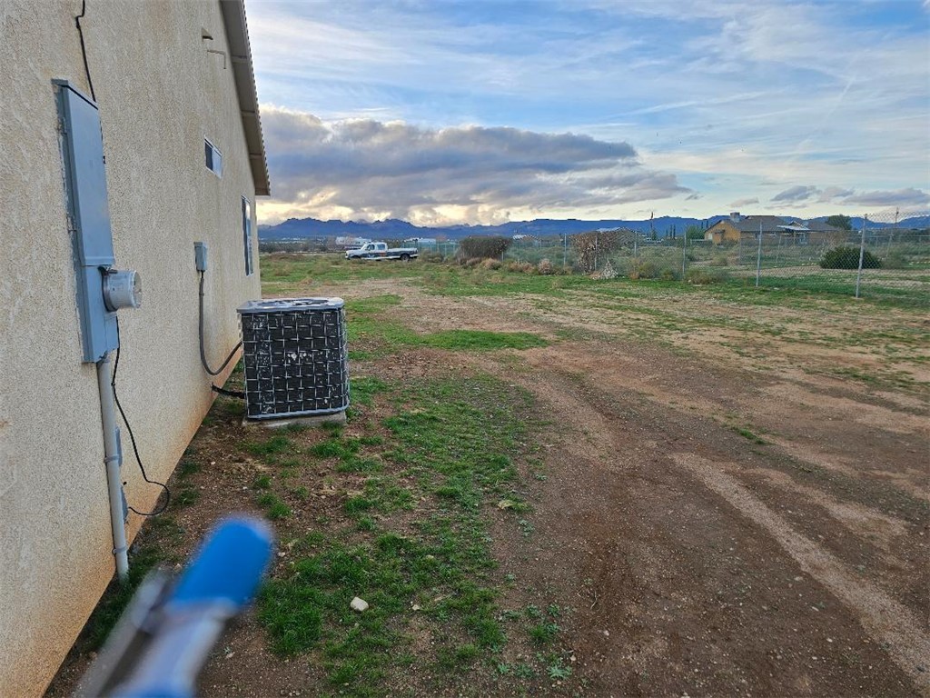 1069 Teddy Roosevelt Road Golden Valley, AZ 86413 - Photo 20 of 24 View of yard featuring a mountain view and a rural view