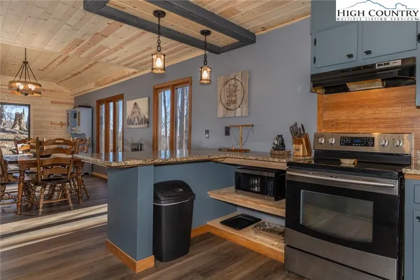 a kitchen with stainless steel appliances granite countertop a stove and a sink