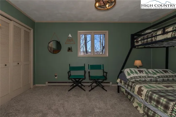 a bedroom with a bed and cabinets