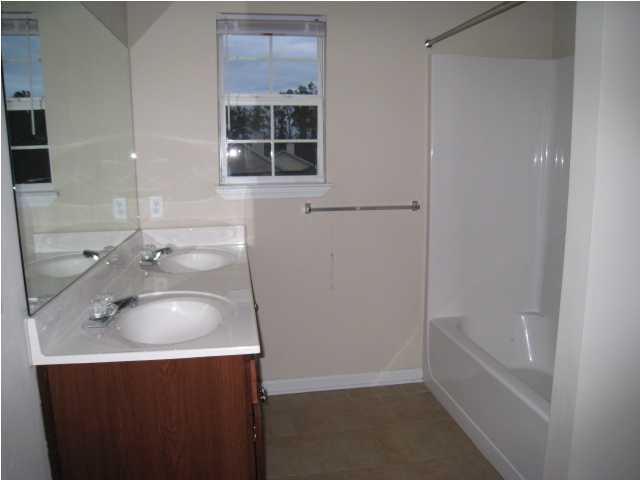 243 Bay Grove Road Freeport, FL 32439 - Photo 12 of 14 a bathroom with a sink and a bathtub