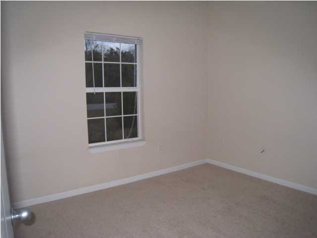 243 Bay Grove Road Freeport, FL 32439 - Photo 8 of 14 an empty room with a window