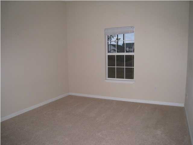 243 Bay Grove Road Freeport, FL 32439 - Photo 9 of 14 an empty room with a window