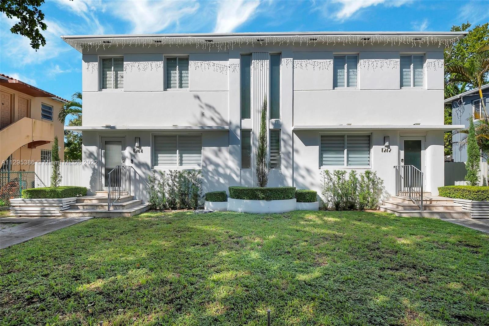 1242 Southwest 13th Avenue Miami, FL 33135 - Photo 1 of 42 a front view of a house with a yard