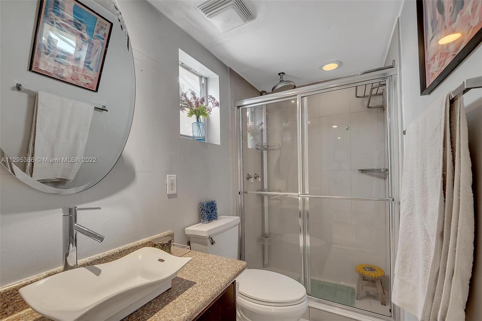1242 Southwest 13th Avenue Miami, FL 33135 - Photo 11 of 42 a bathroom with a toilet a sink and shower