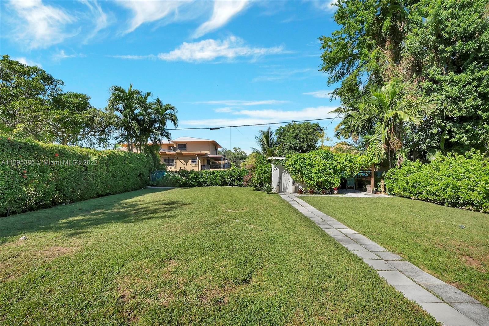 1242 Southwest 13th Avenue Miami, FL 33135 - Photo 12 of 42 a view of a yard with a house