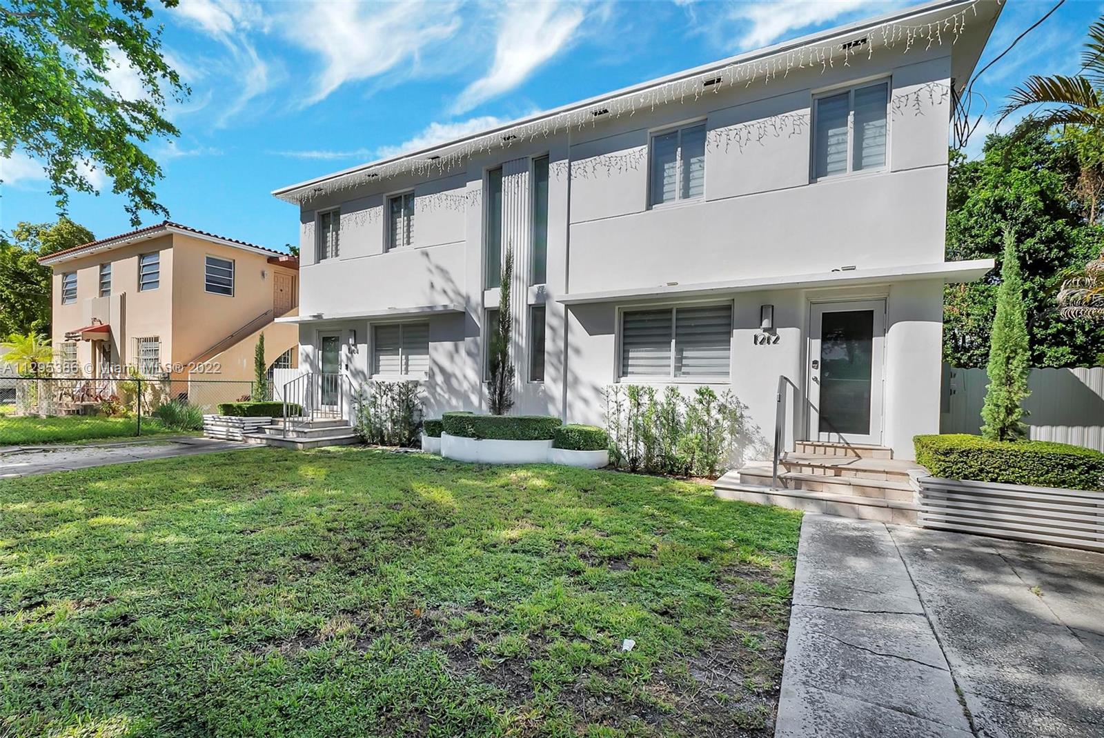 1242 Southwest 13th Avenue Miami, FL 33135 - Photo 2 of 42 a view of a house with a yard